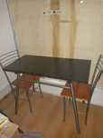 Mesa em granito preto mais cadeiras