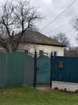 Продам 1/2 частину будинку з земельною ділянкою. М. Лебедин ,