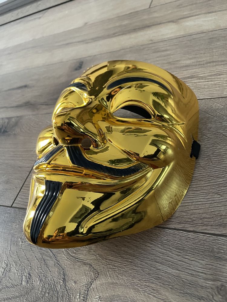 Złota maska na halloween. Anonymous