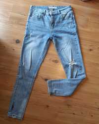 Damskie spodnie jeans S/M z dziurami
