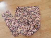 wzorzyste spodnie w kwiaty Mohito 38
