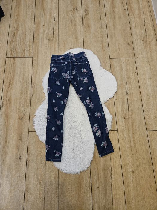 Spodnie dziewczynka w kwiaty kieszenie 128