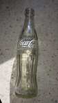 Szklana butelka po coca-coli. Coca Cola