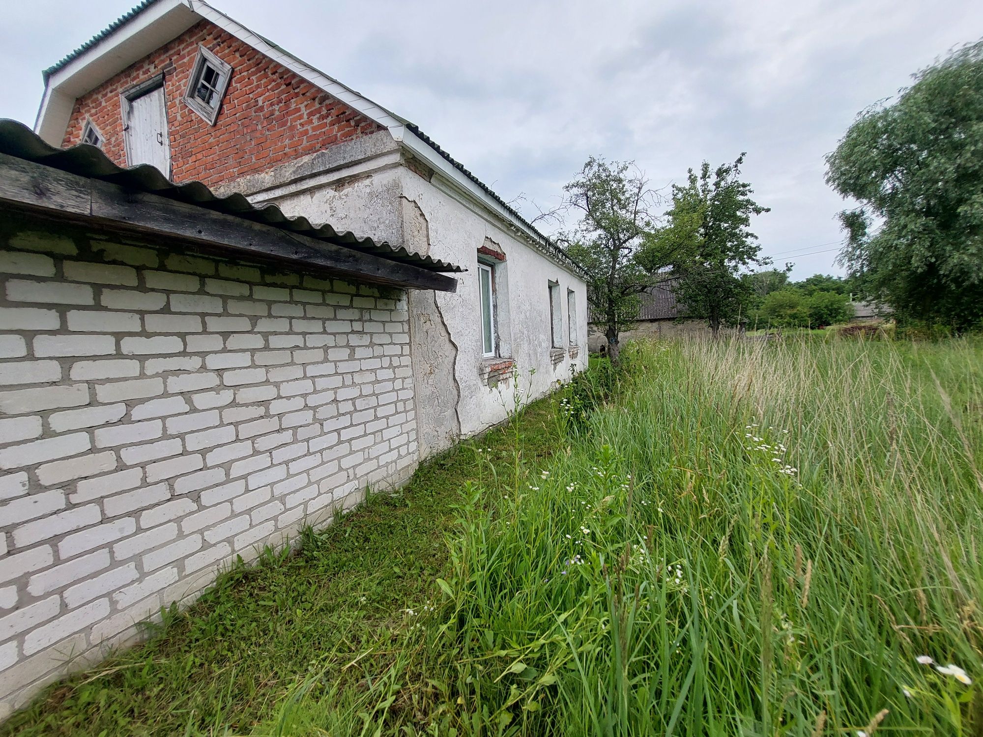 Будинок із земельною ділягкою під сільське господарство 0.1500 га