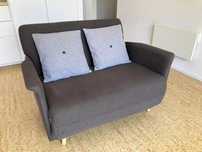 Sofá-cama cinzento