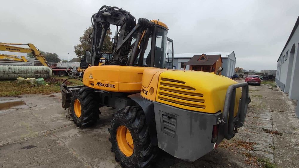 Koparko-ładowarka Mecalac 12MTX. Rok produkcji 2012. Komplet łyżek