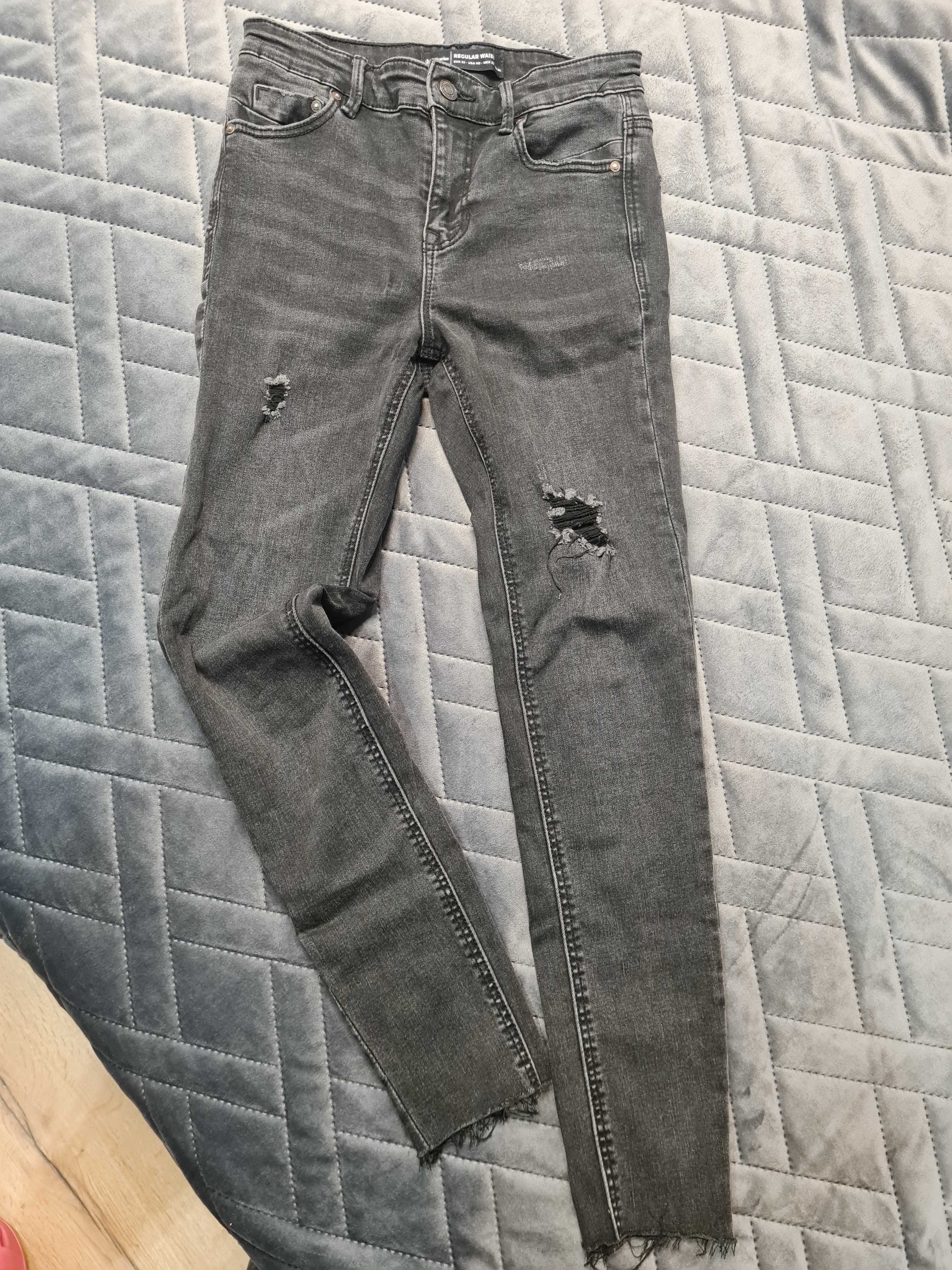 Spodnie skinny jeansy z dziurami Stradivarius rozmiar 32