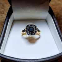 Złoty pierścionek 585 elegancki z czarnymi cyrkoniami i rodem r 15