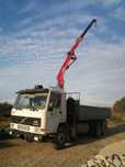 Volvo fl10 tribasculante com grua