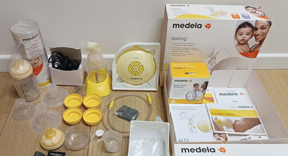 Medela Swing laktator elektryczny dwufazowy + butelka + nakładki + ...