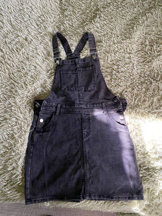 Жіночий джинсовий комбінезон