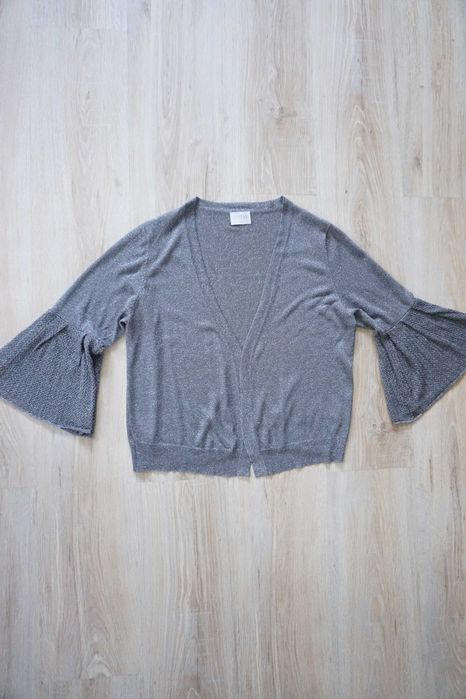Połyskujący sweterek/narzutka