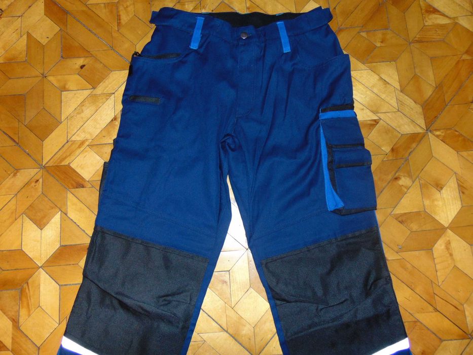 Profesjonalne niemieckie spodnie robocze 11 kieszeni pas 70-74 cm NOWE