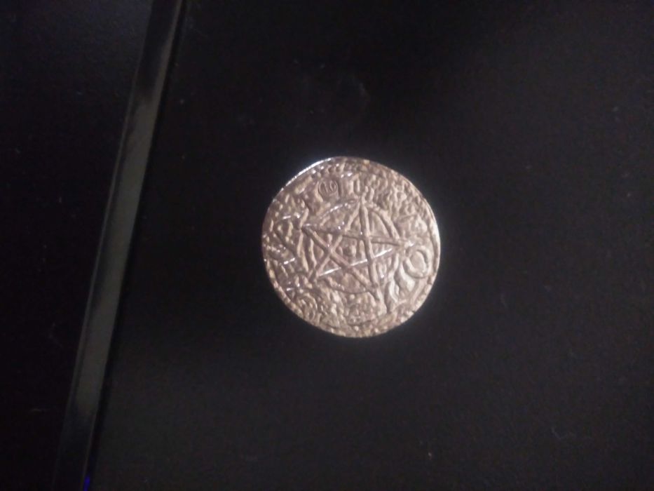 Moeda com gravura de estrela