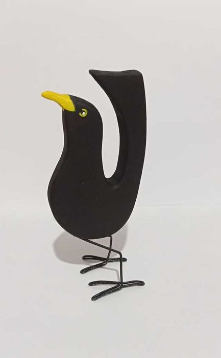 Conjunto de melros em madeira.