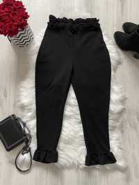 Czarne spodnie z falbanką damskie leginsy M