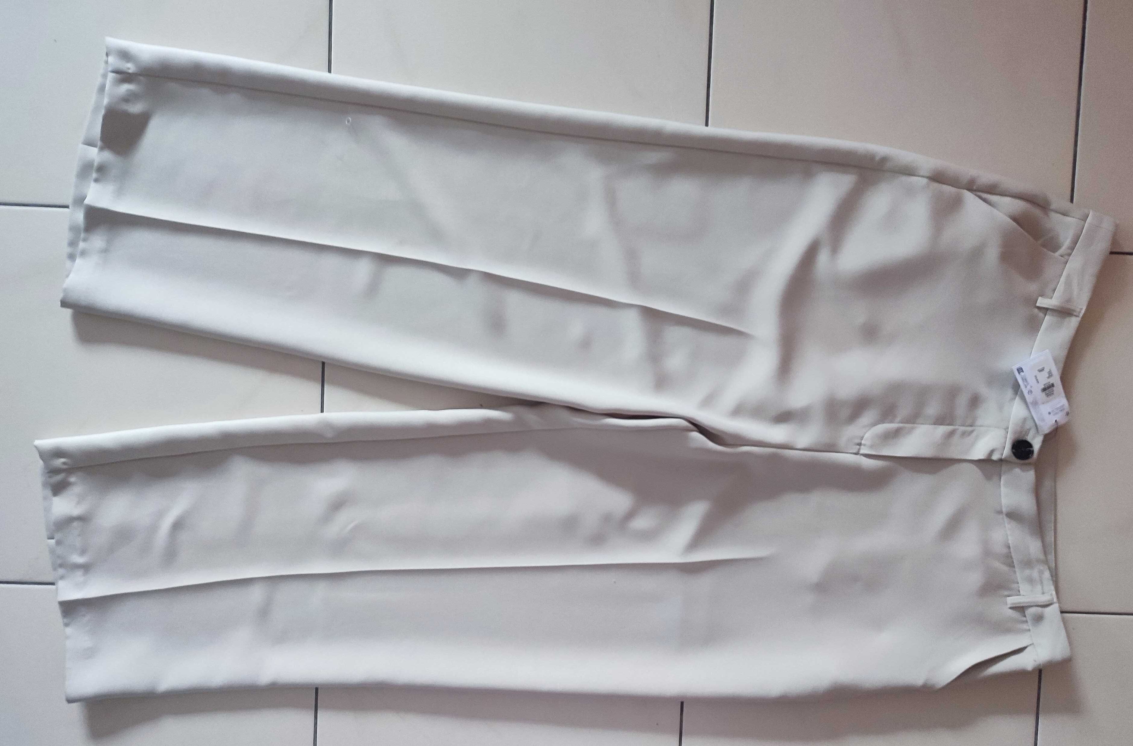 Primark kremowe spodnie 48/52, metka nowe