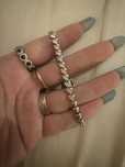 Pulseira marca Unike em prata,zirconias com coracoes,17cm