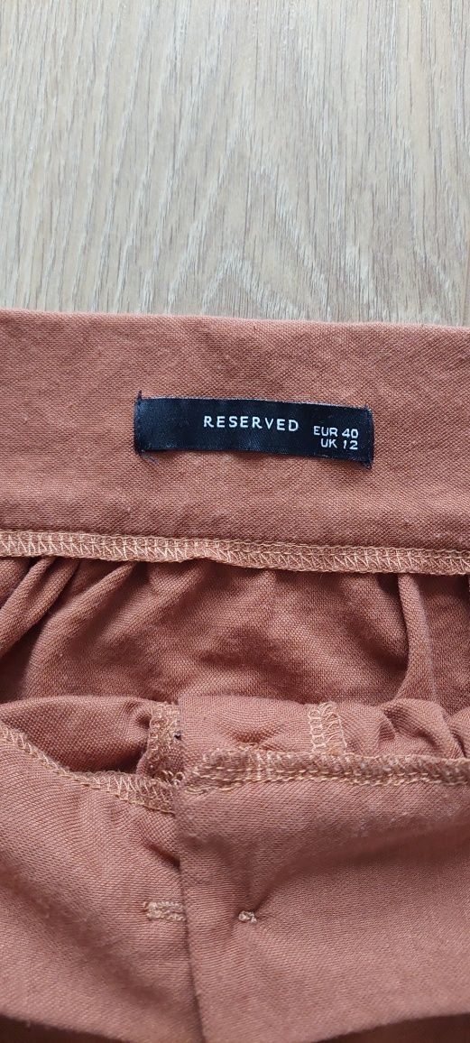 Reserved r.40 ceglana ruda spódnica midi z kieszeniami
