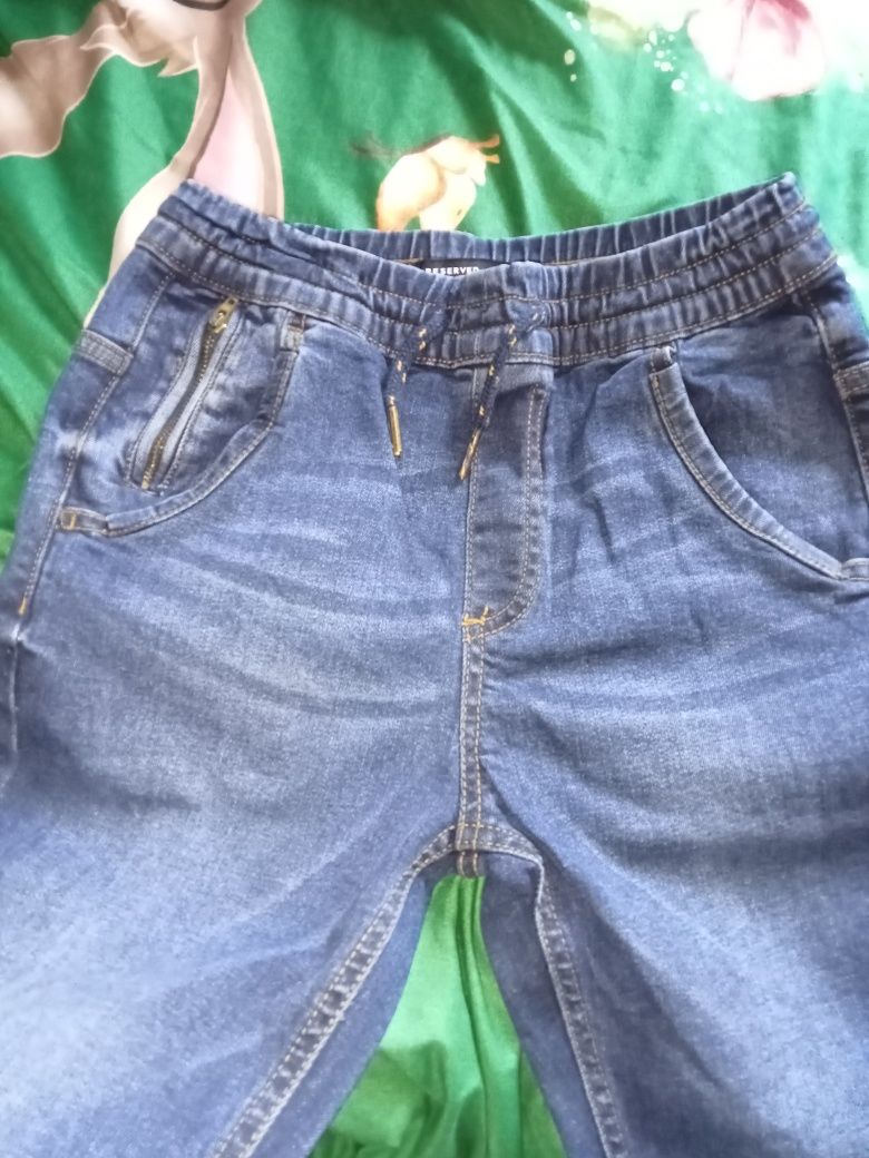 Spodnie jeansy na gumce 140 Reserved młodzieżowe