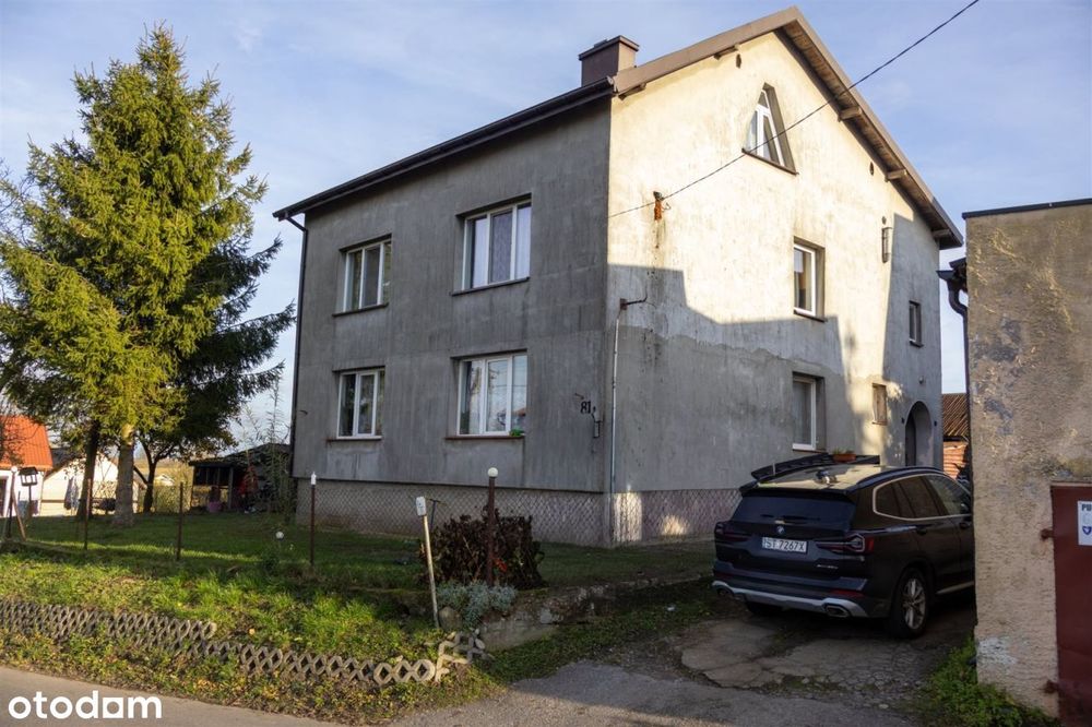 Dom z dwoma mieszkaniami i budynkiem gosp– Szczuka
