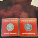 Dwie monety pomnik szpital sercem budowany