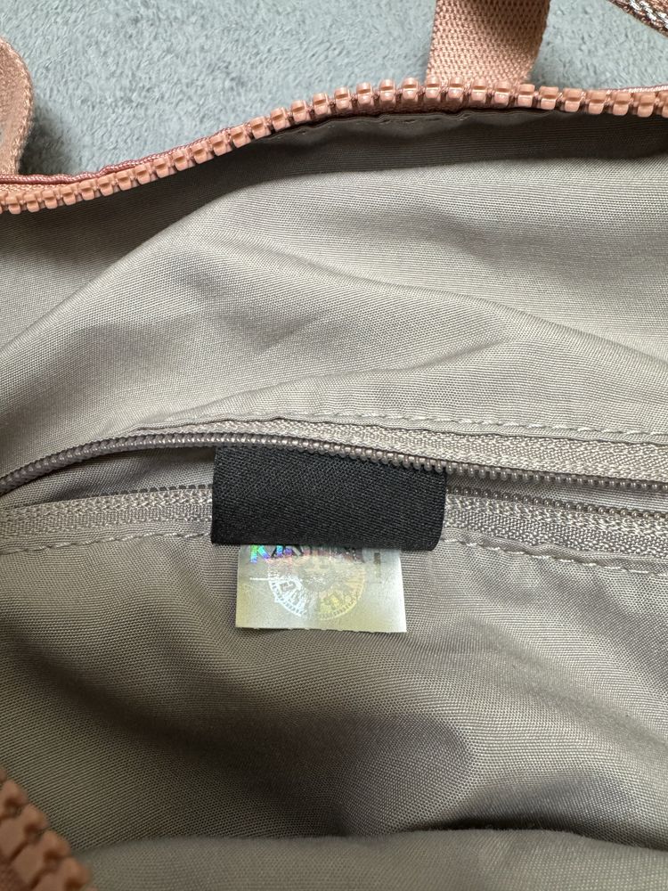 Kipling Adila Metallic Rust With Monkey Tagged