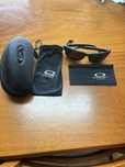 Óculos escuros Oakley polarizados modelo 9102
