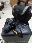 NikonD3000 + optica Sigma 18-55mm + lente Sigma UV + carregador + mala