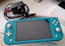 Nintendo Lite switch pudełko instrukcja ładowarka
