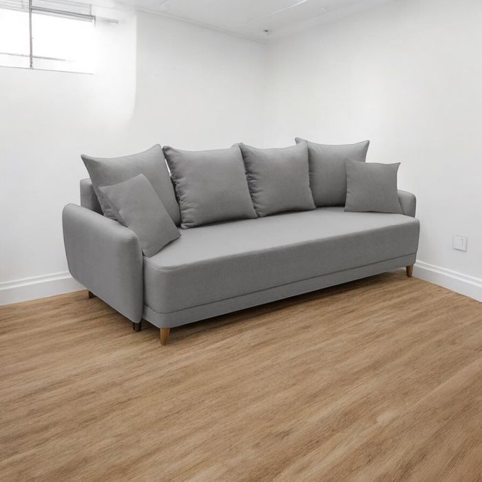 Używana szara sofa z funkcją spania rozkładana transport