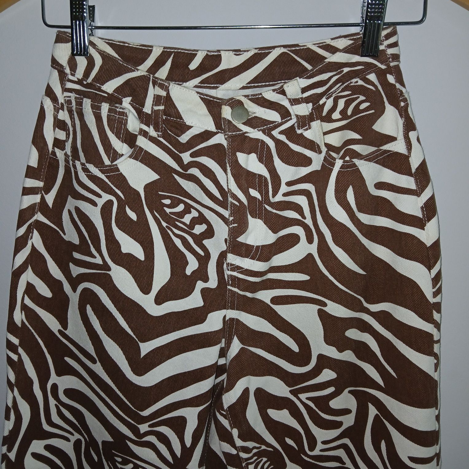Calças wide-leg com padrão zebra branco e castanho