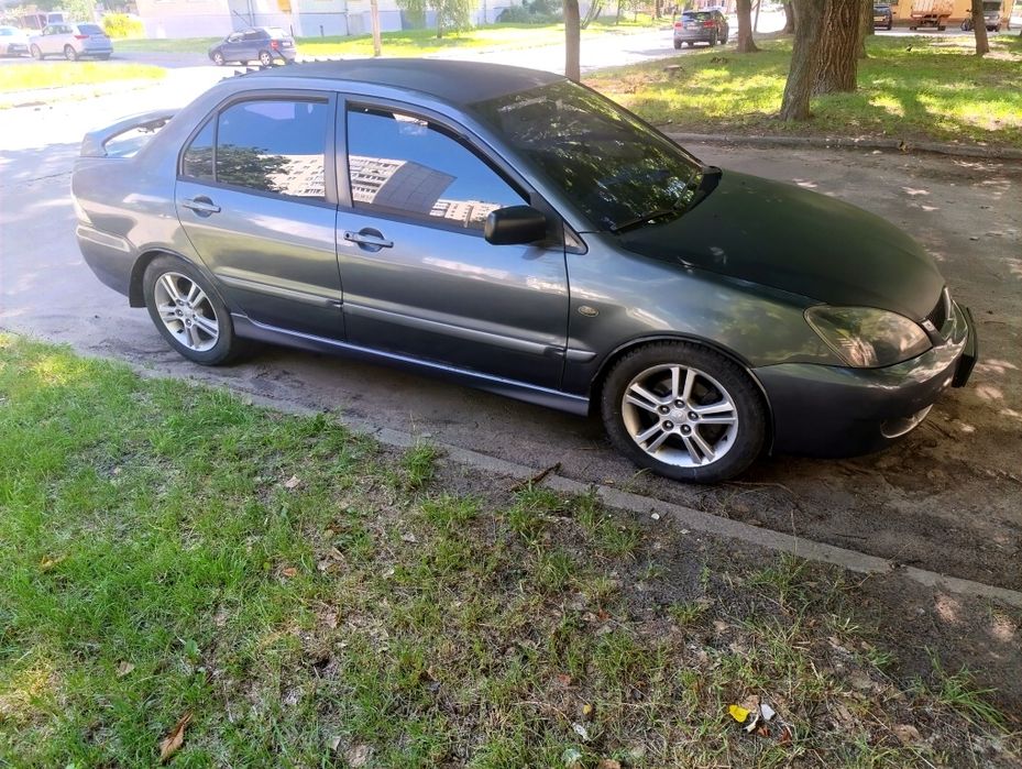 Лансер 9 спорт версія 2.0 газ-бензин на  автоматі тонований в круг!