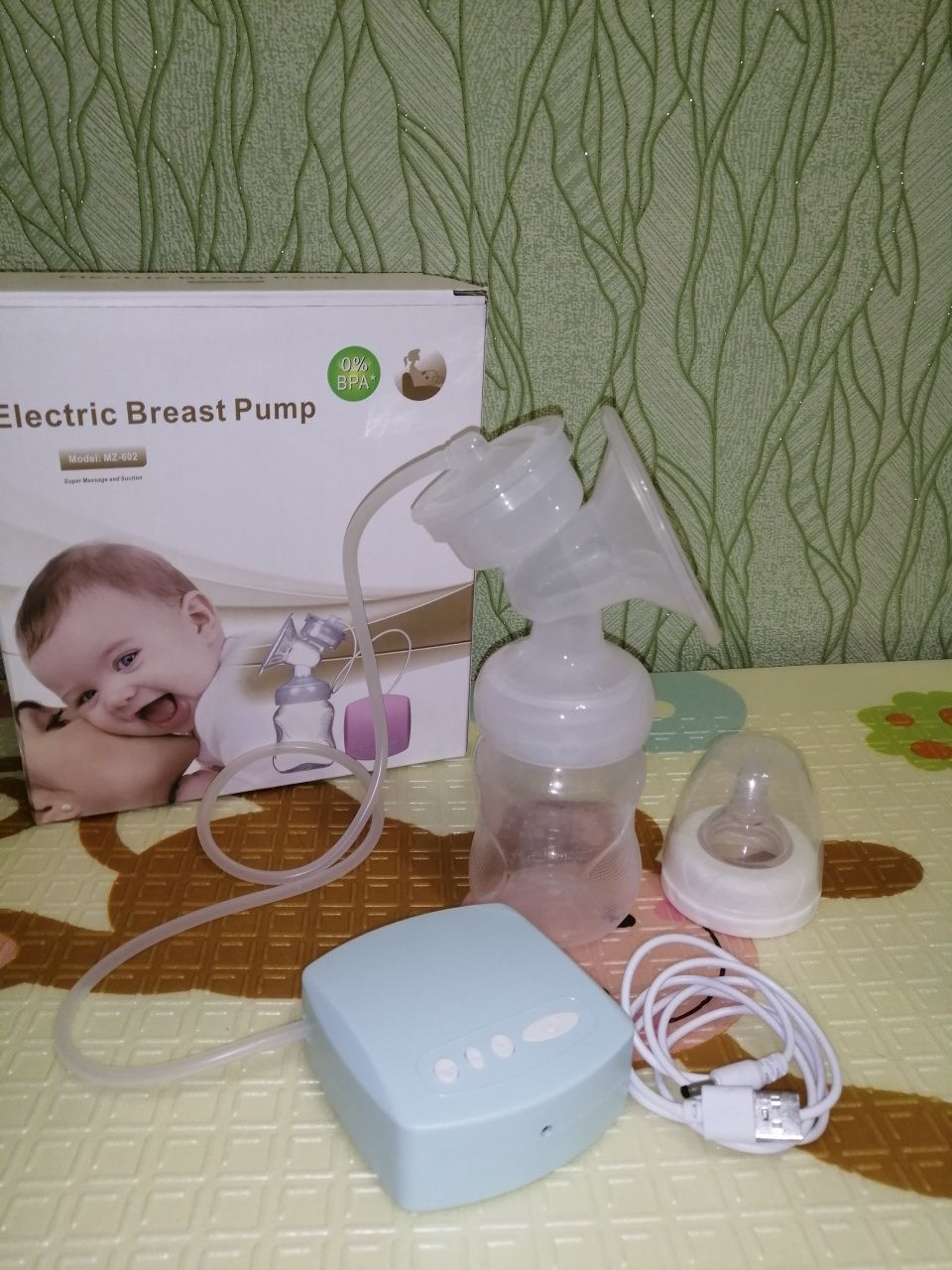 Молоковідсмоктувач ручний Canpol babies та електричний Breast Pump.