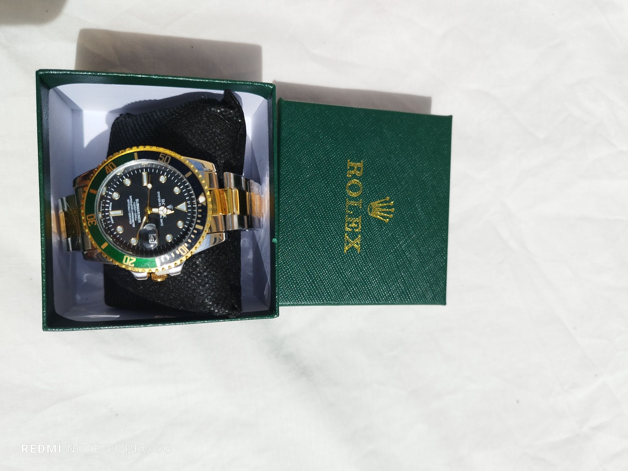 Relógio rolex dourado e verde