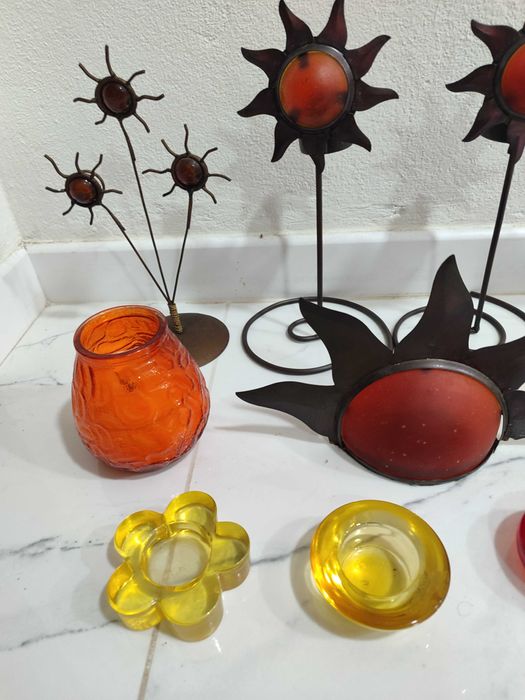 11 porta velas altos em metal e vidro com formato Sol