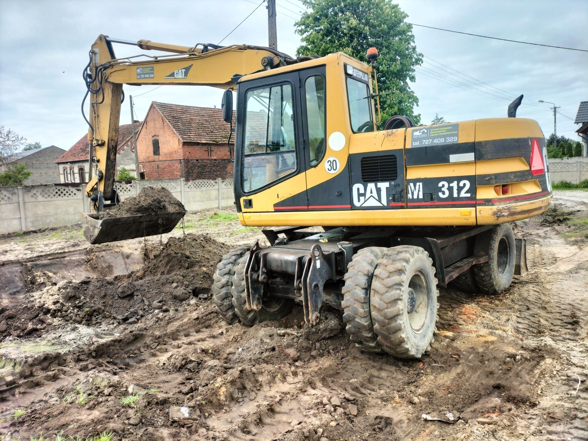 Koparka kołowa Cat M312 rok 2002