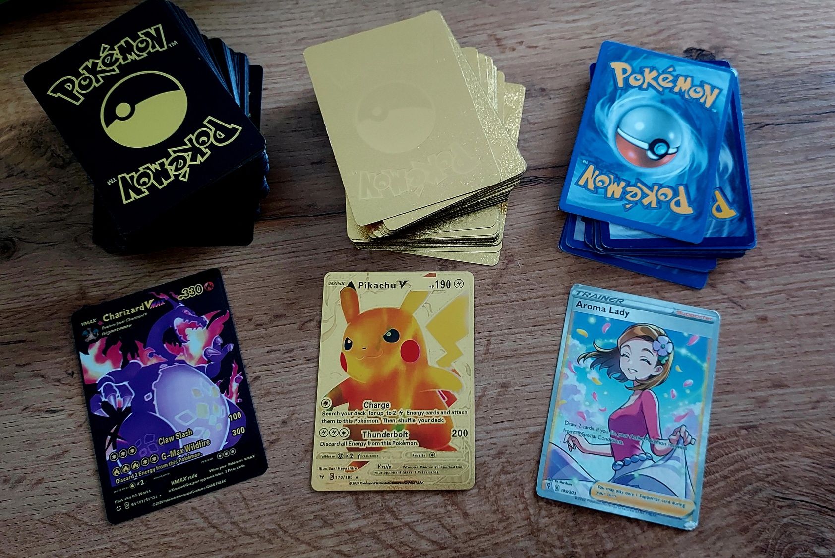 Kolekcja karty pokemon zlote, czarne, niebieskie + 2 albumy