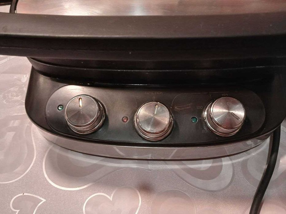 . Гриль DeLonghi.