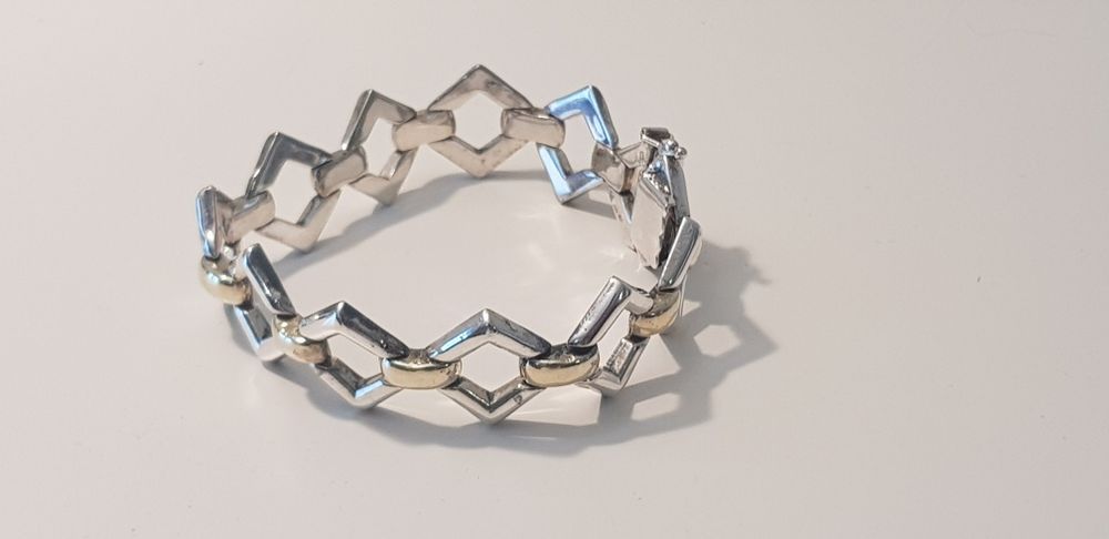 Pulseira semi rígida Prata e Ouro