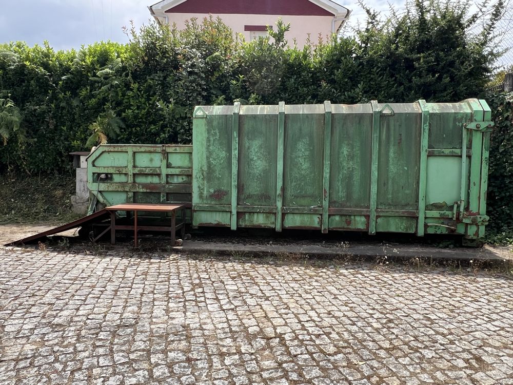 Contentor compactador