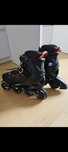 Patins em linha pretos