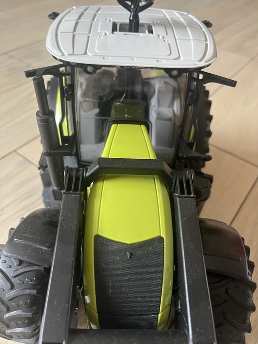 Bruder брудер трактор з навантажувачем Axion 950