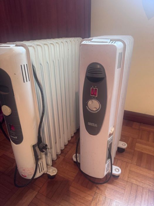 três aquecedores, dois a óleo e um elétrico