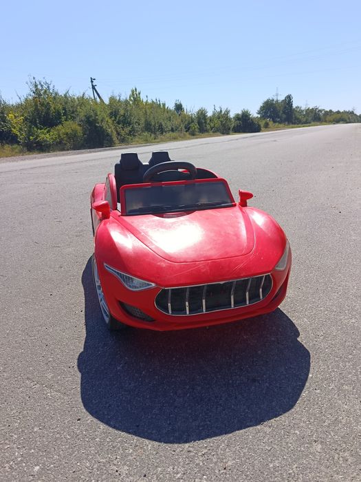 Дитячий електромобіль Tilly "Maseratti" музичний T-7637 EVA RED