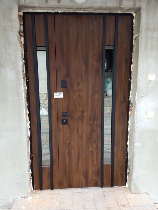 Двері вхідні Вікна