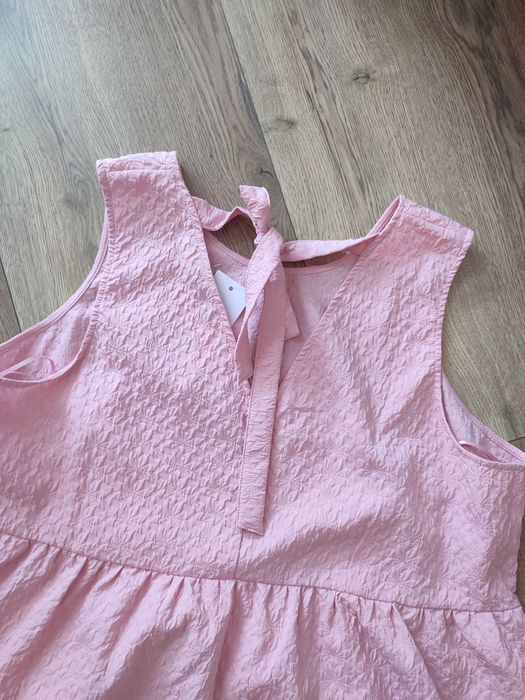 Różowa bluzka z baskinką