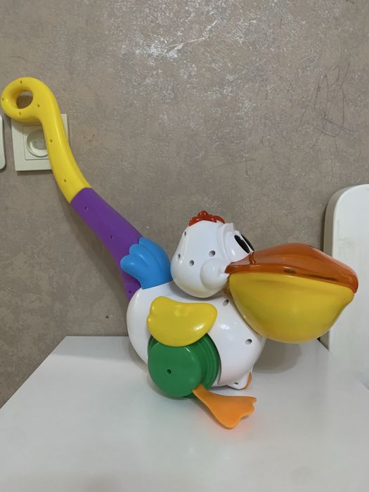 Іграшка Каталка пелікан  kiddieland Украінська