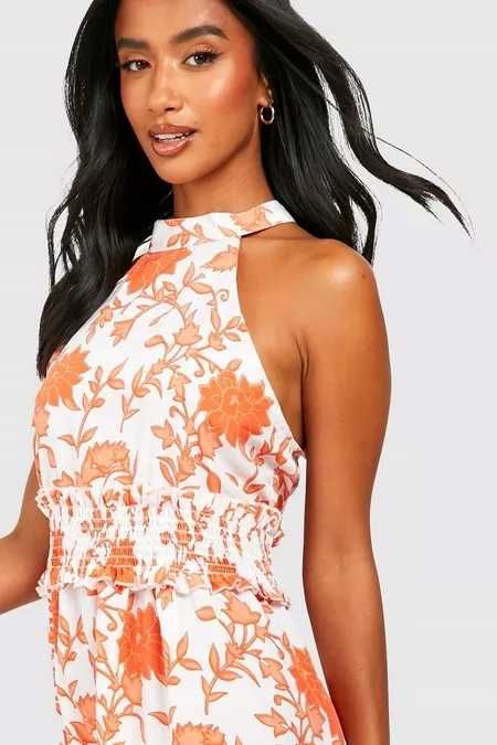 Zwiewna asymetryczna sukienka dekolt halter boho falbana