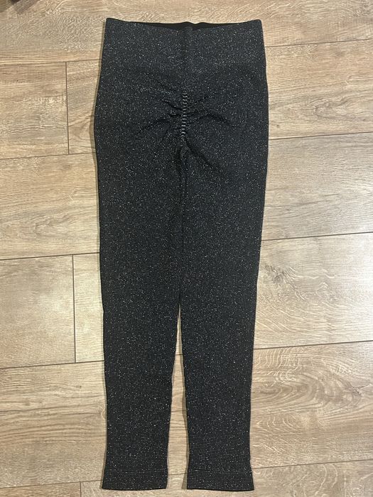 Piękne nowe błyszczące święcące legginsy push up L